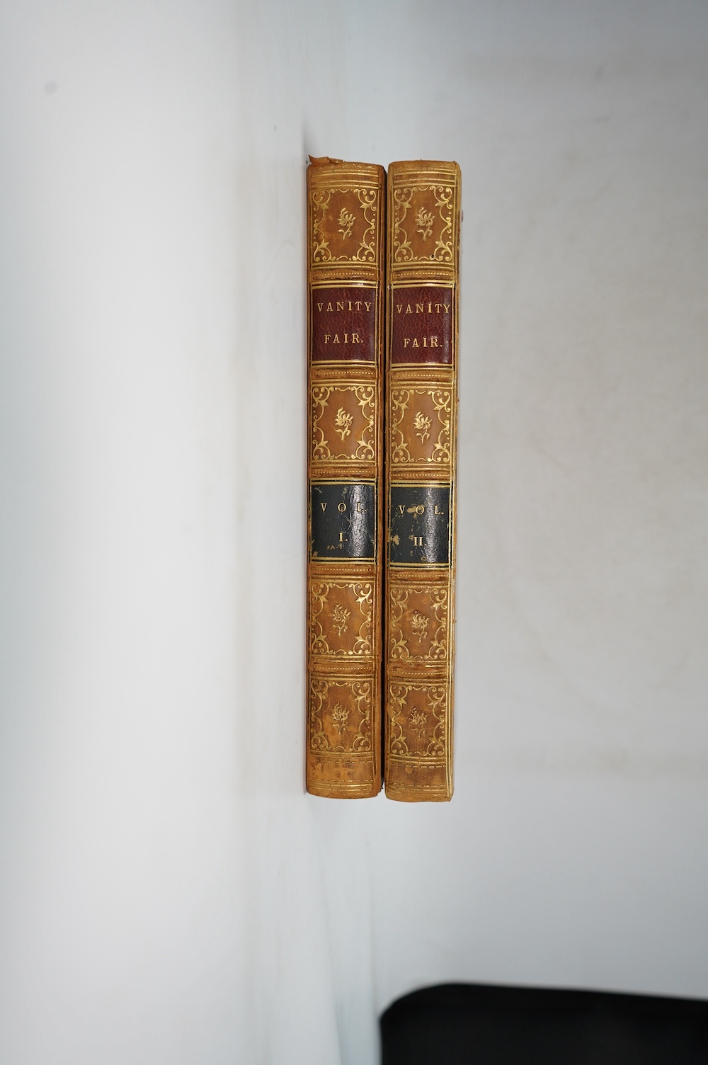 Thackeray, William Makepeace - Vanity Fair. A Novel Without a Hero. First Edition (bound as 2 vols.) engraved pictorial (vol.1) and printed (vol.2) titles, 39 plates and num. text engravings; contemp. gilt ruled half cal